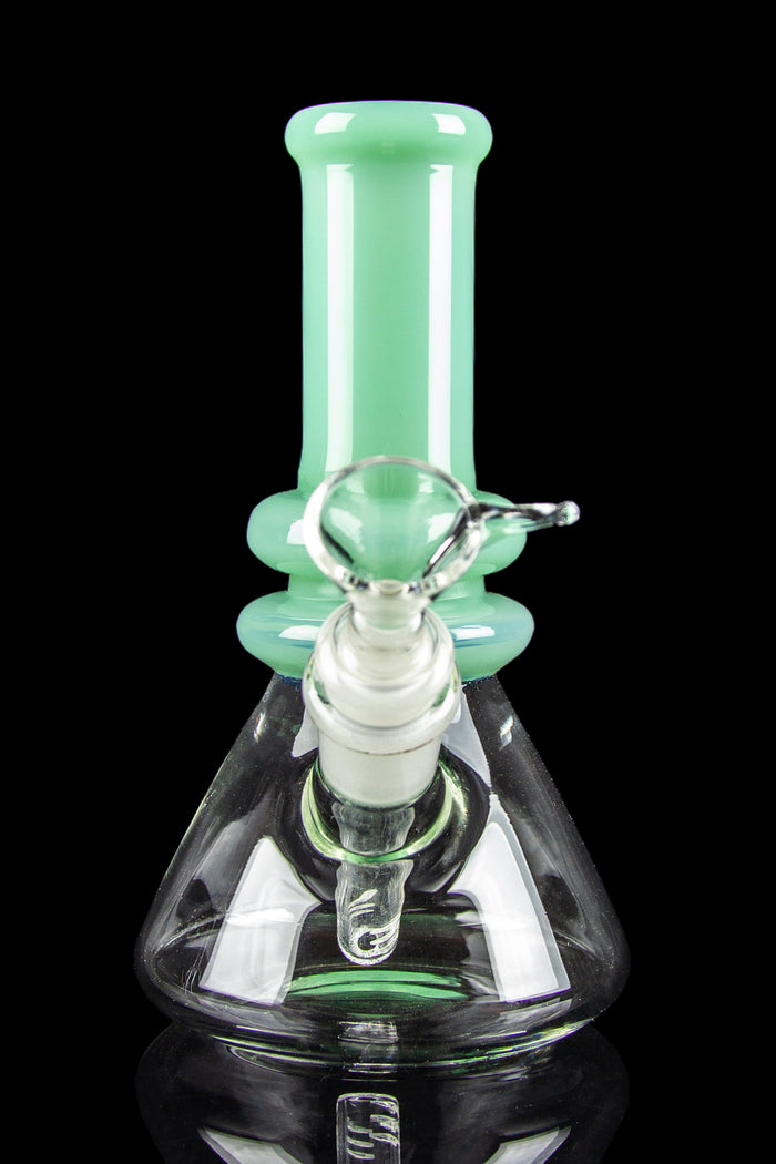 A green and clear glass bong with intricate bubble detailing and a wide base.