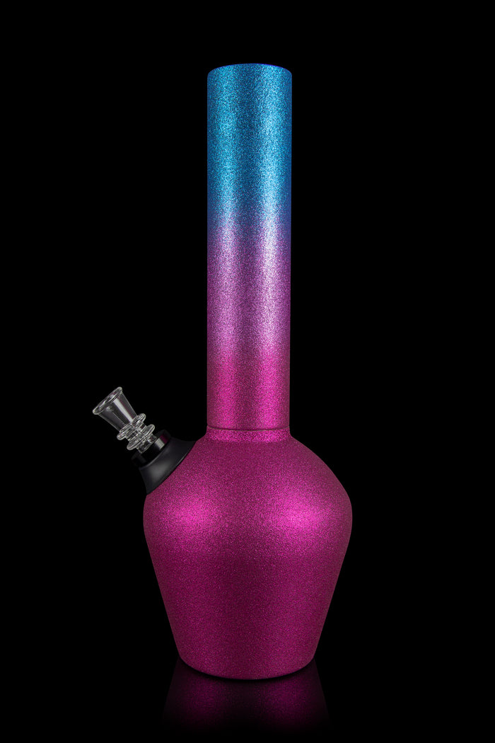 A vibrant, textured glass water pipe with a gradient from deep purple to blue, set against a black reflective surface.