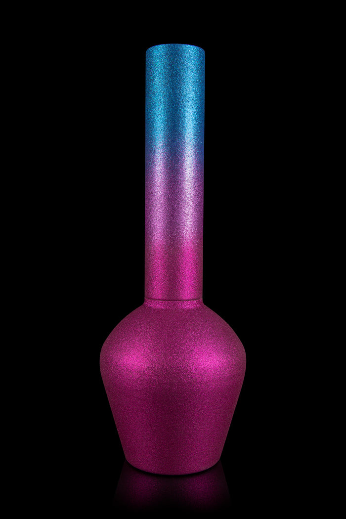 Glimmering pink and blue glass water pipe isolated on black.