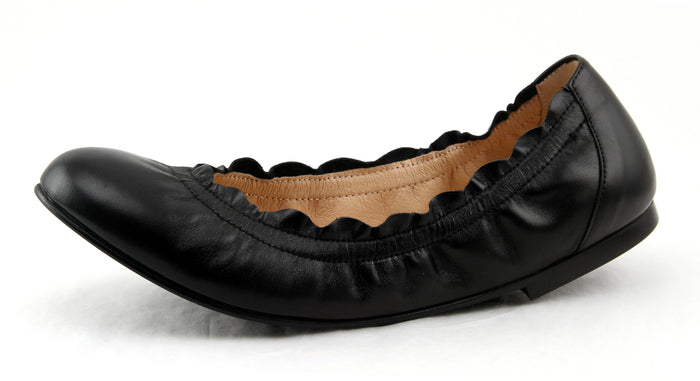 black leather ballet flat with a rounded toe and elasticated topline. angle view
