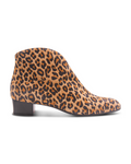 Leopard suede ankle boot with a low block heel and a smooth, minimal silhouette. Side view