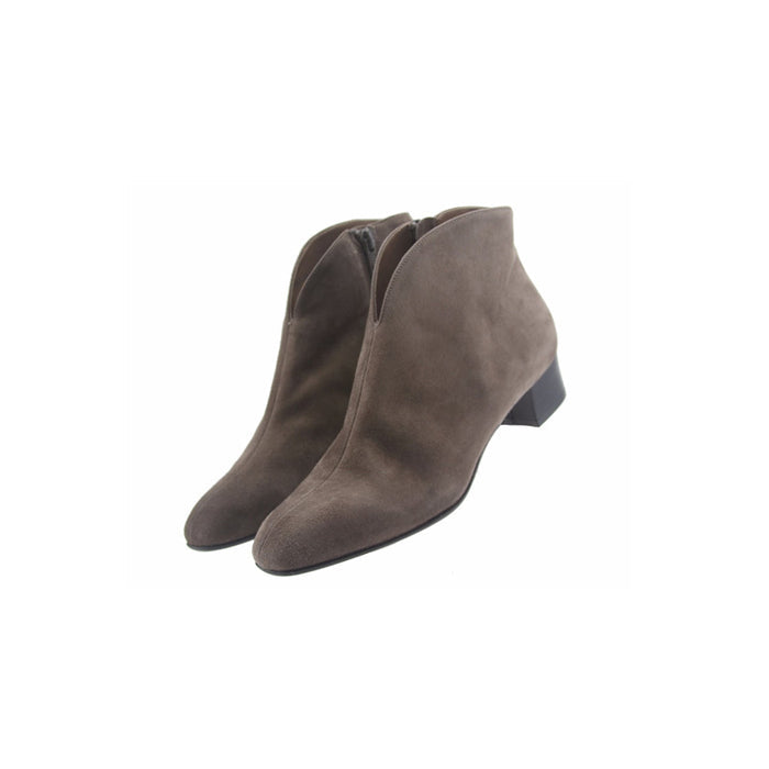 grey suede ankle boot with a low block heel and a smooth, minimal silhouette. both shoes angle view
