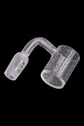 Frosted glass cannabis dab rig with intricate geometric patterns.
