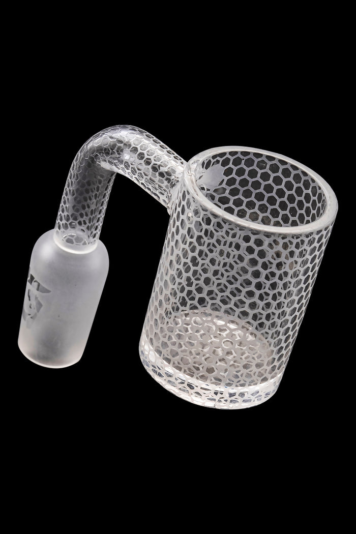 Frosted glass cannabis dab rig with honeycomb pattern.