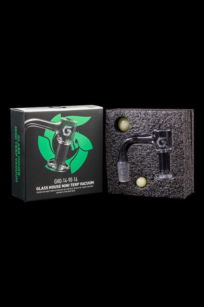 Glass House Mini Terp Vacuum dab rig with green accents, displayed in its retail packaging.