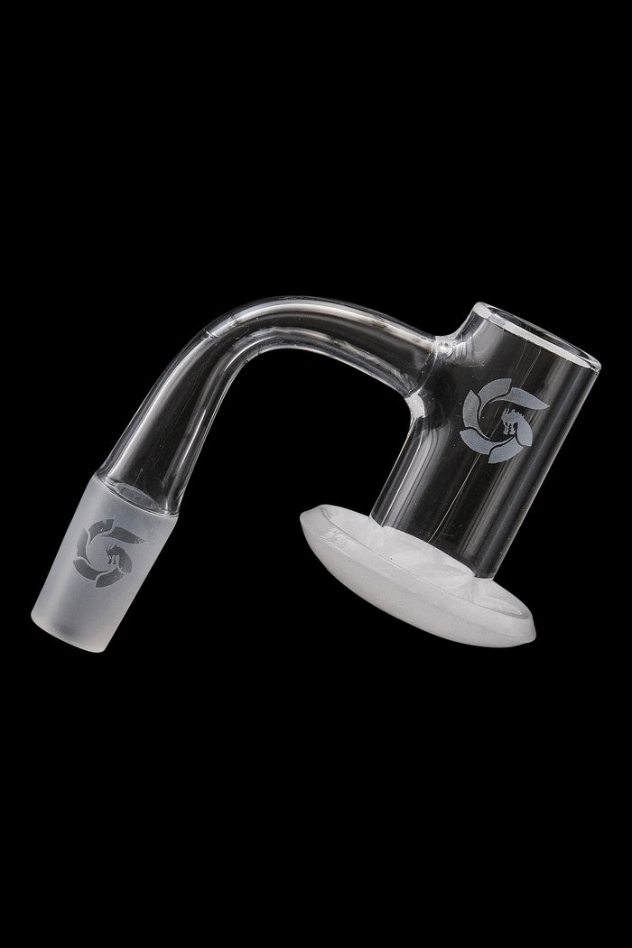Clear quartz dab rig insert with etched logo, isolated on black.