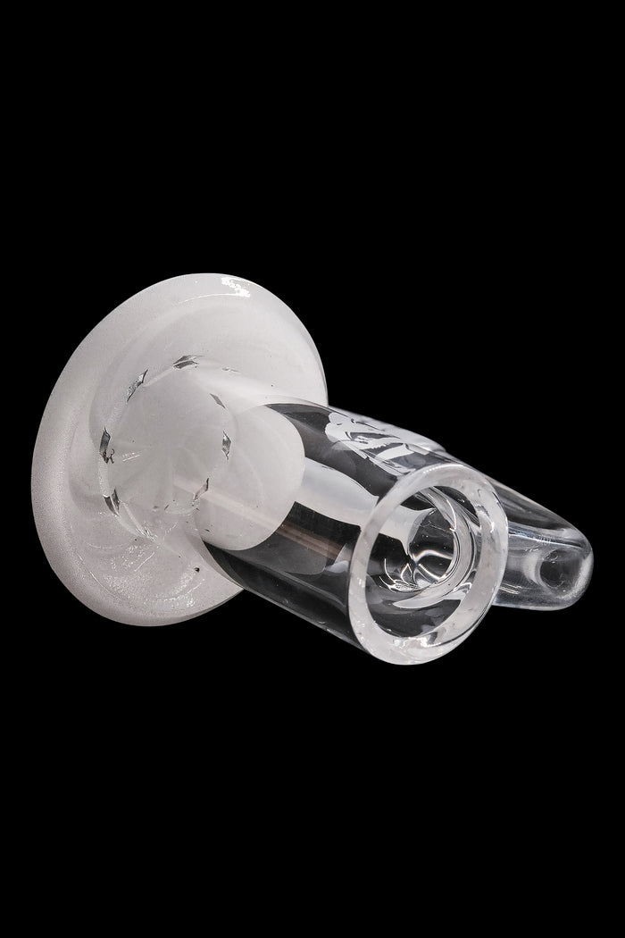 Clear glass cannabis bubbler with intricate swirling patterns.