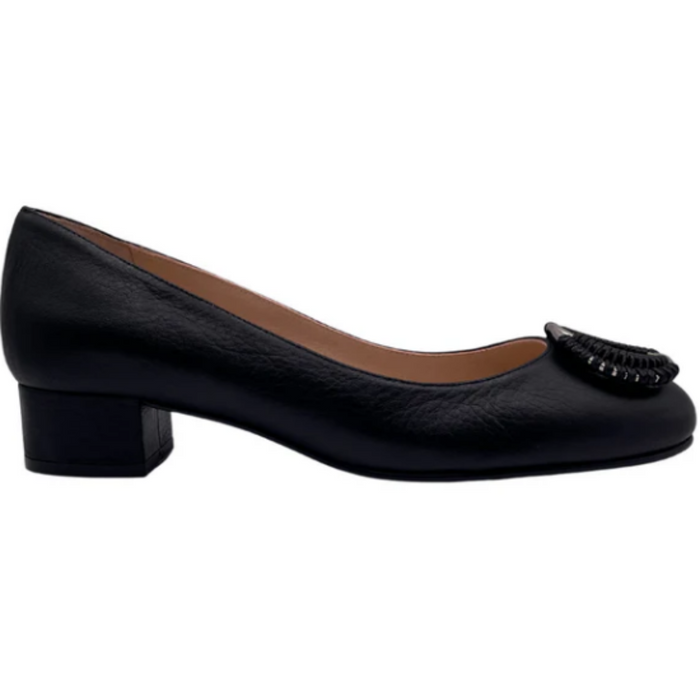 Black leather pump with a rounded toe, block heel, and a silver buckle wrapped in black detailing on the toe box SIDE VIEW