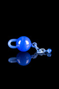 Blue glass water pipe with chain against a black background.