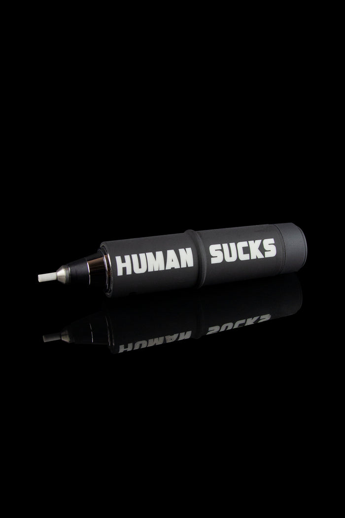 Black cannabis smoking pipe with white text reading “HUMAN SUCKS” displayed on its side.