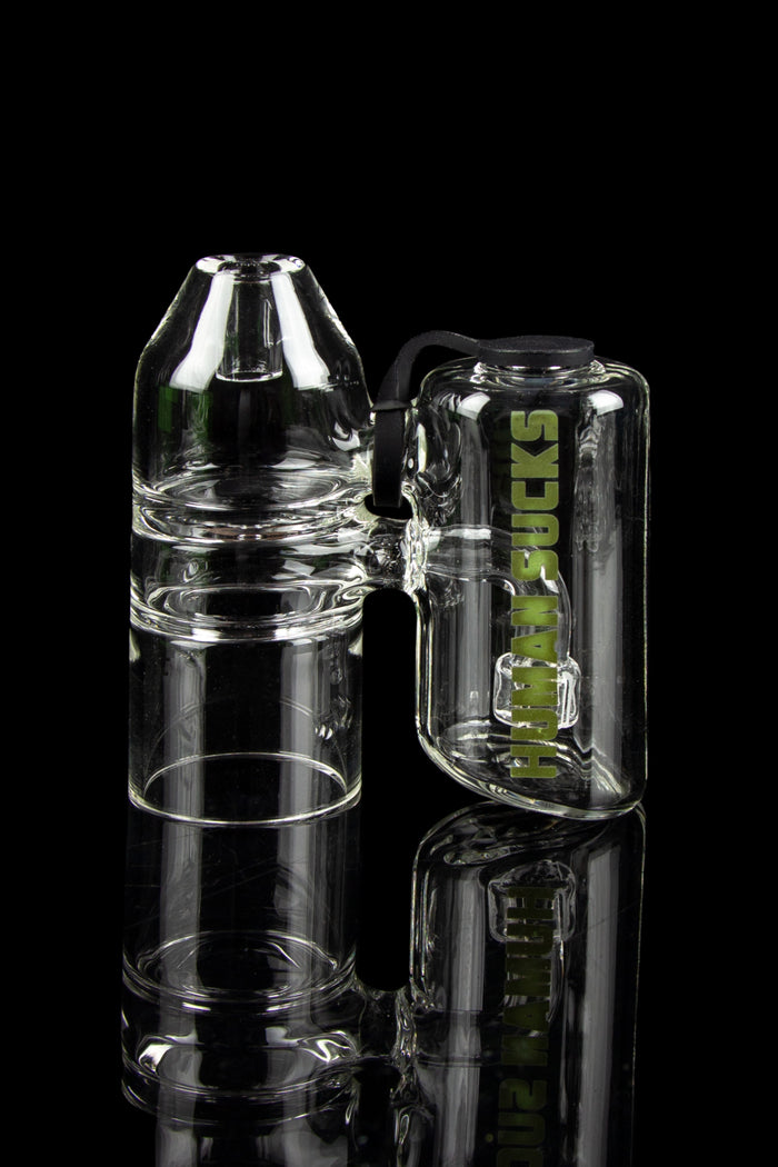 Clear glass bubbler water pipe with “HUMAN SUCKS” branding, stacked against a black background.