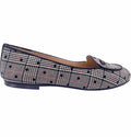 A flat shoe with a black and white plaid pattern and a cushioned leather footbed.