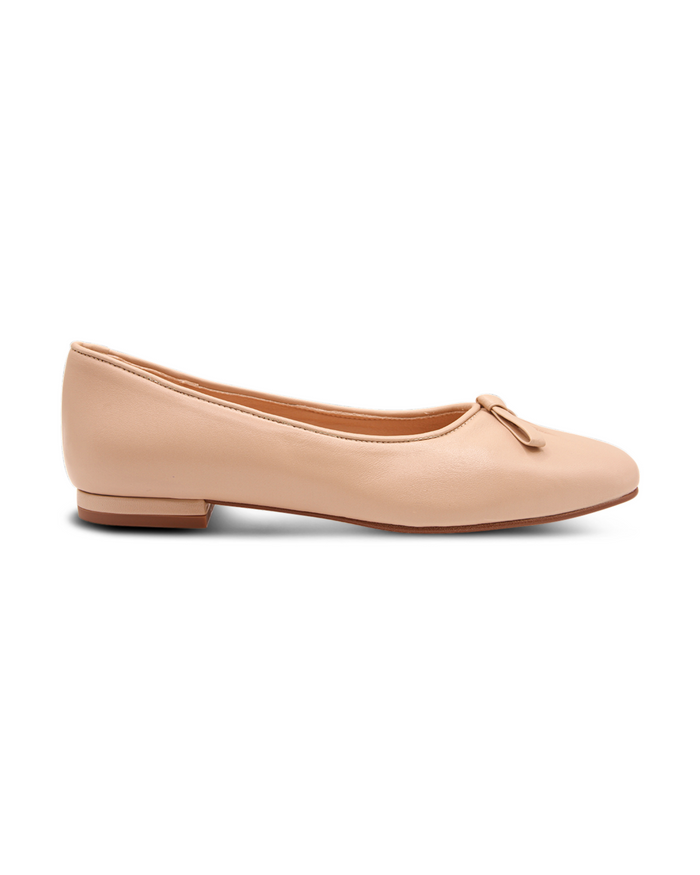 Beige leather ballet flat with a soft square toe, an elongated toe box, and a small beige leather flatten bow detail on the front. side view