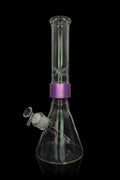 Glass bong with purple accents against a black background.