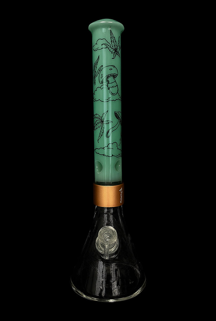 Vertical front view of the Prism Halo Mint Sky High Modular Bong showing a mint green patterned tube with black cloud and mushroom illustrations above a gold modular collar and clear glass beaker base.