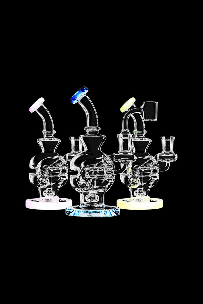 A studio shot displays the Pulsar Mini Egg Dab Rig, showcasing its compact size and clear glass construction from a slightly angled perspective.