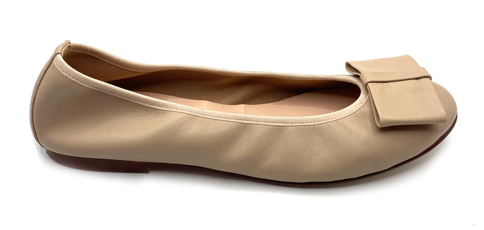 Beige leather ballet flat with a rounded toe and a large folded bow accent on the front. Side view