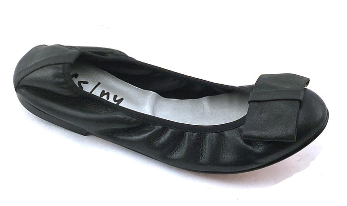 black metallic leather ballet flat with a rounded toe and a large folded bow accent on the front. angle view