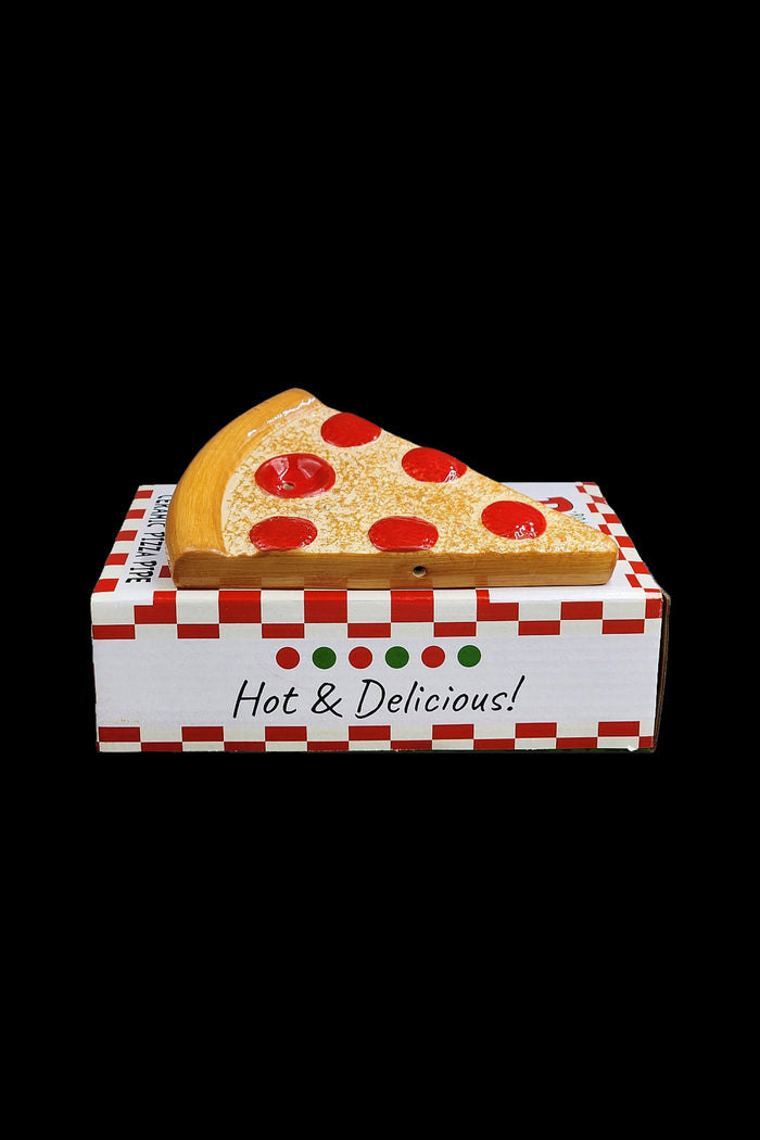 Cannabis pipe shaped like a slice of pizza in a pizza box labeled “Hot & Delicious!”