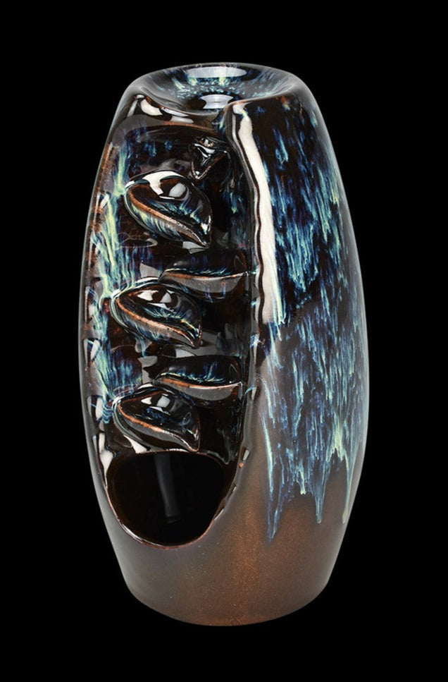 Front view of the Back Flow Magic Ceramic Incense Burner, showing a dark, textured ceramic with a glossy finish.