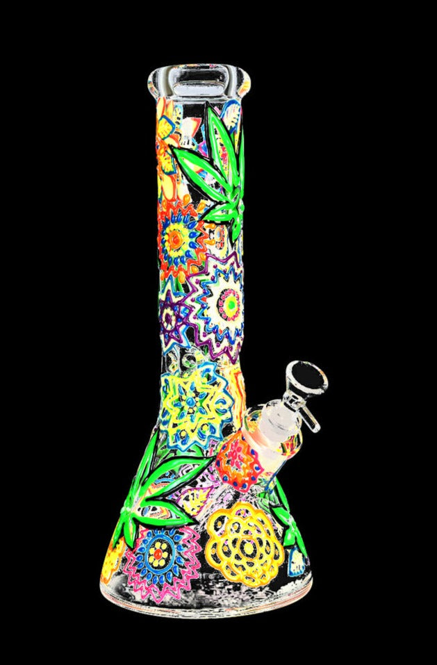 Front view of the Mandala Hemp Leaf Glow In The Dark Beaker Water Pipe, displaying a vibrant, patterned glass design.