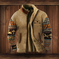 Veste en laine grise avec doublure en fourrure, manches à motifs ethniques colorés, détails en cuir marron, sur fond de bois rustique.